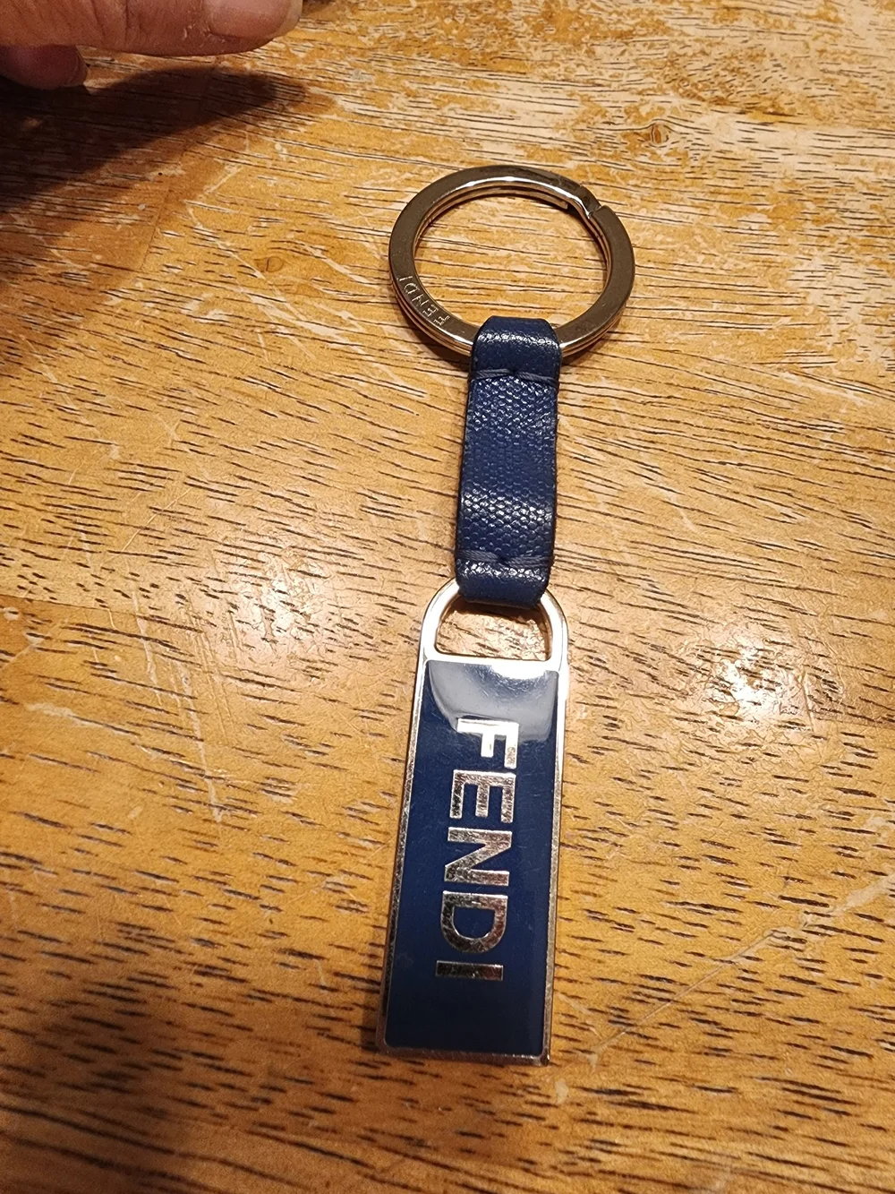 blue leather Fendi logo plaque keychain features silver-tone hardware